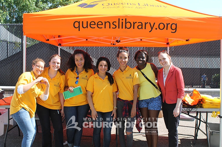 Church of God volunteers prepare to serve visitors of the Queens Book Festival.