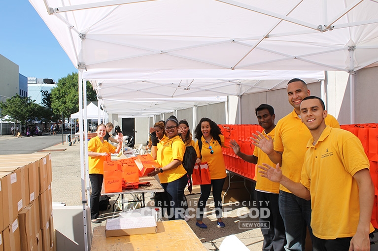 Church of God volunteers prepare to serve visitors of the Queens Book Festival.