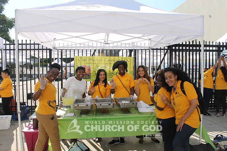Church of God volunteers prepare to serve visitors of the Queens Book Festival.