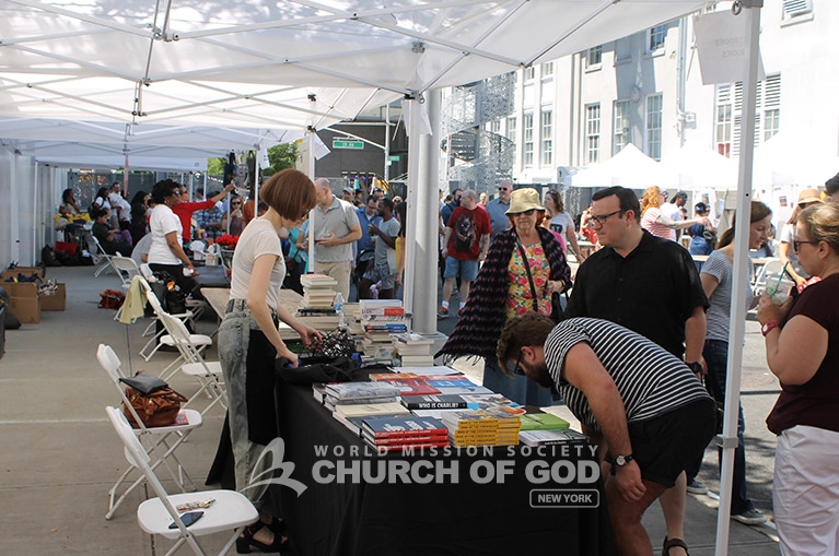 Church of God volunteers prepare to serve visitors of the Queens Book Festival.